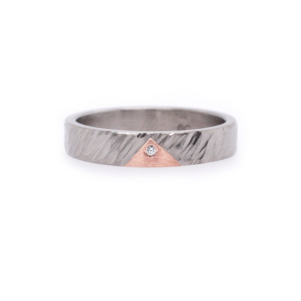 Linear hammered palladium band with red gold pyramid motif and white diamond accent. Handmade by EC Design Studio in Minneapolis, MN using recycled metal and conflict-free stone.