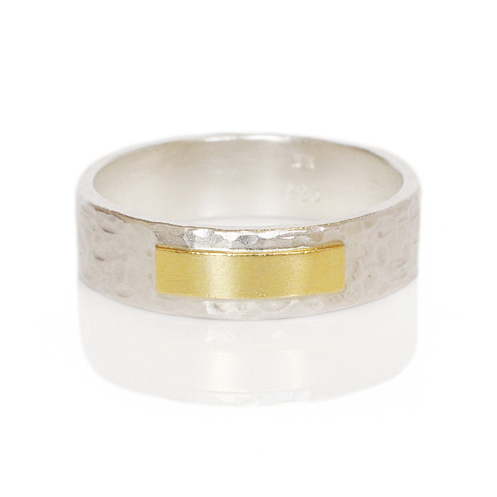 Handmade by EC Designs in Minneapolis. Hand hammered sterling silver with yellow gold accent.