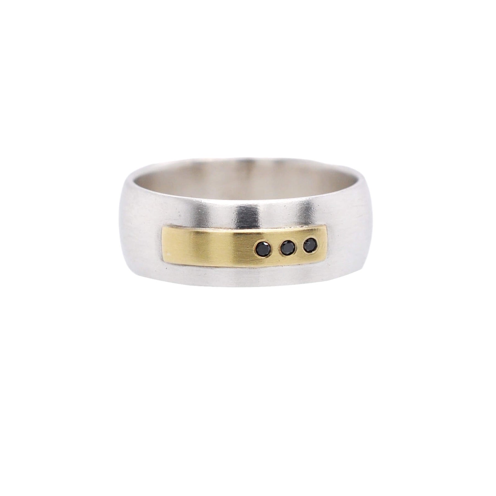 Low dome sterling silver band with yellow gold and black diamond accents. Handmade by EC Design Jewelry in Minneapolis, MN using recycled metal and conflict-free stones.