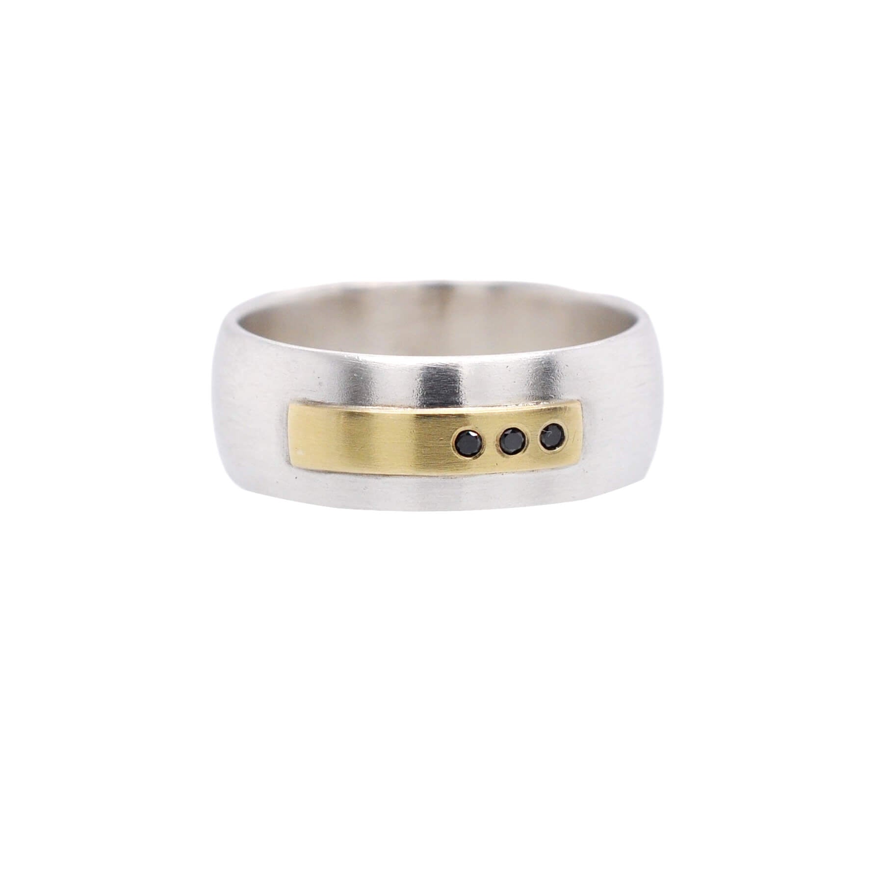 Low dome sterling silver band with yellow gold and black diamond accents. Handmade by EC Design Jewelry in Minneapolis, MN using recycled metal and conflict-free stones.