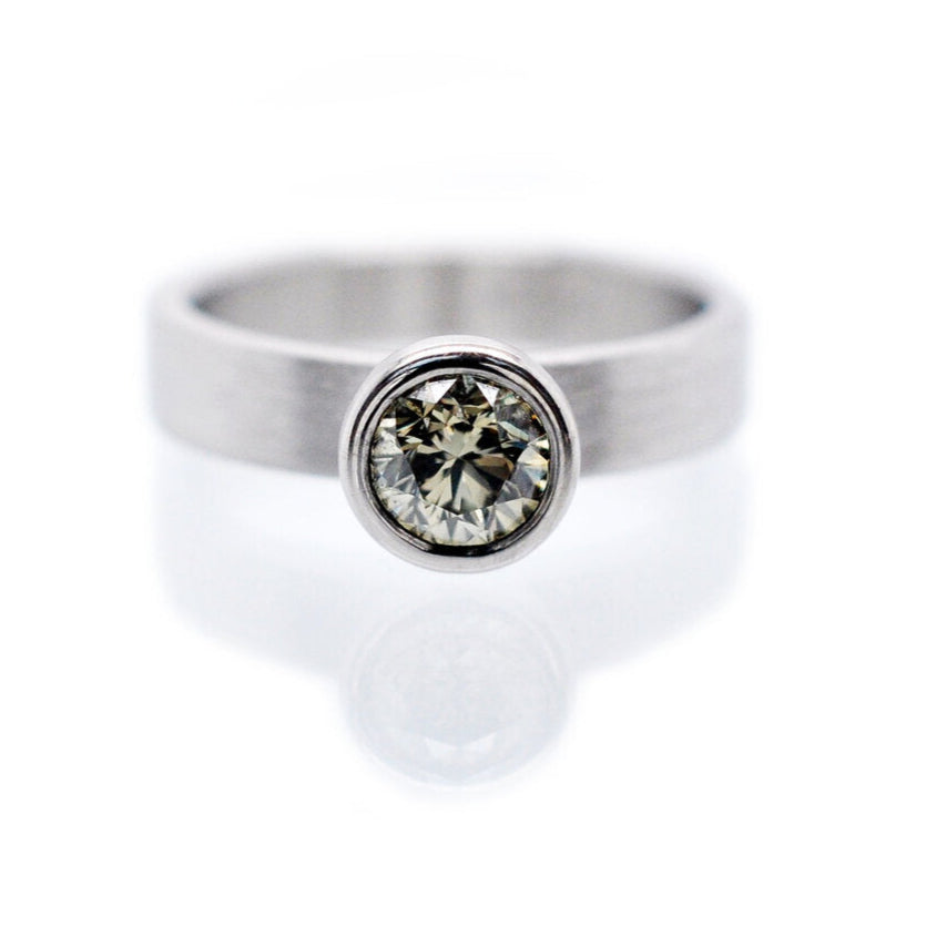 Modern engagement ring. Natural green brilliant cut diamond in palladium. Handmade by EC Design Studio in Minneapolis, MN using recycled metal and conflict-free stone.