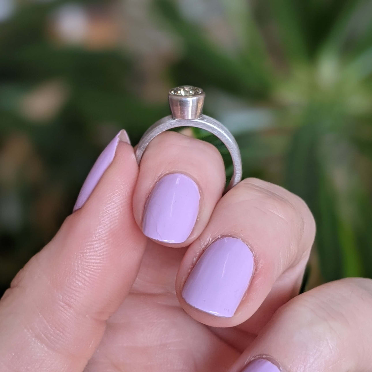 Modern engagement ring. Natural green brilliant cut diamond in palladium. Handmade by EC Design Jewelry in Minneapolis, MN using recycled metal and conflict-free stone.