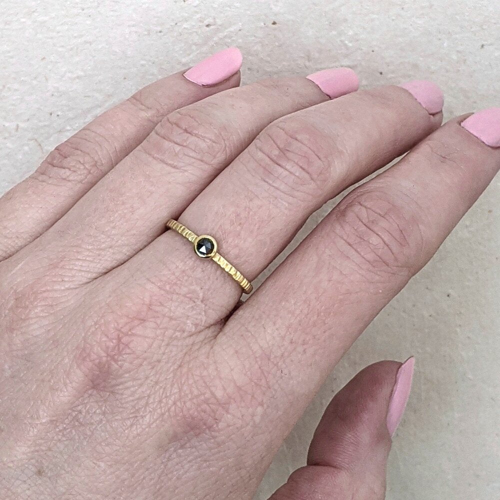 Alternative engagement ring with delicate black diamond and yellow gold ring. Handmade by EC Design Studio in Minneapolis, MN using recycled metal and conflict-free stone.