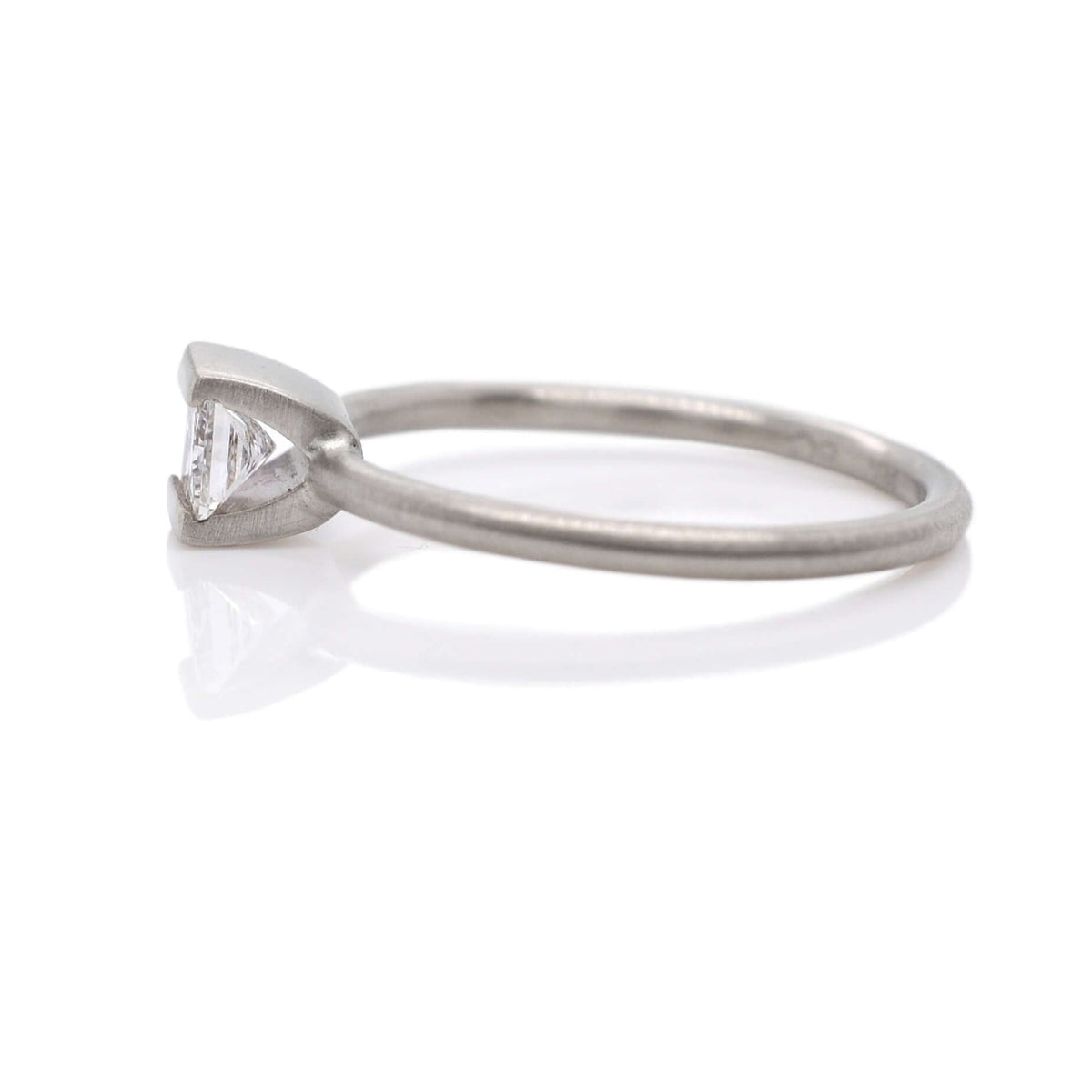 Diamond engagement ring in white gold. Handmade with recycled metal and conflict-free stone.