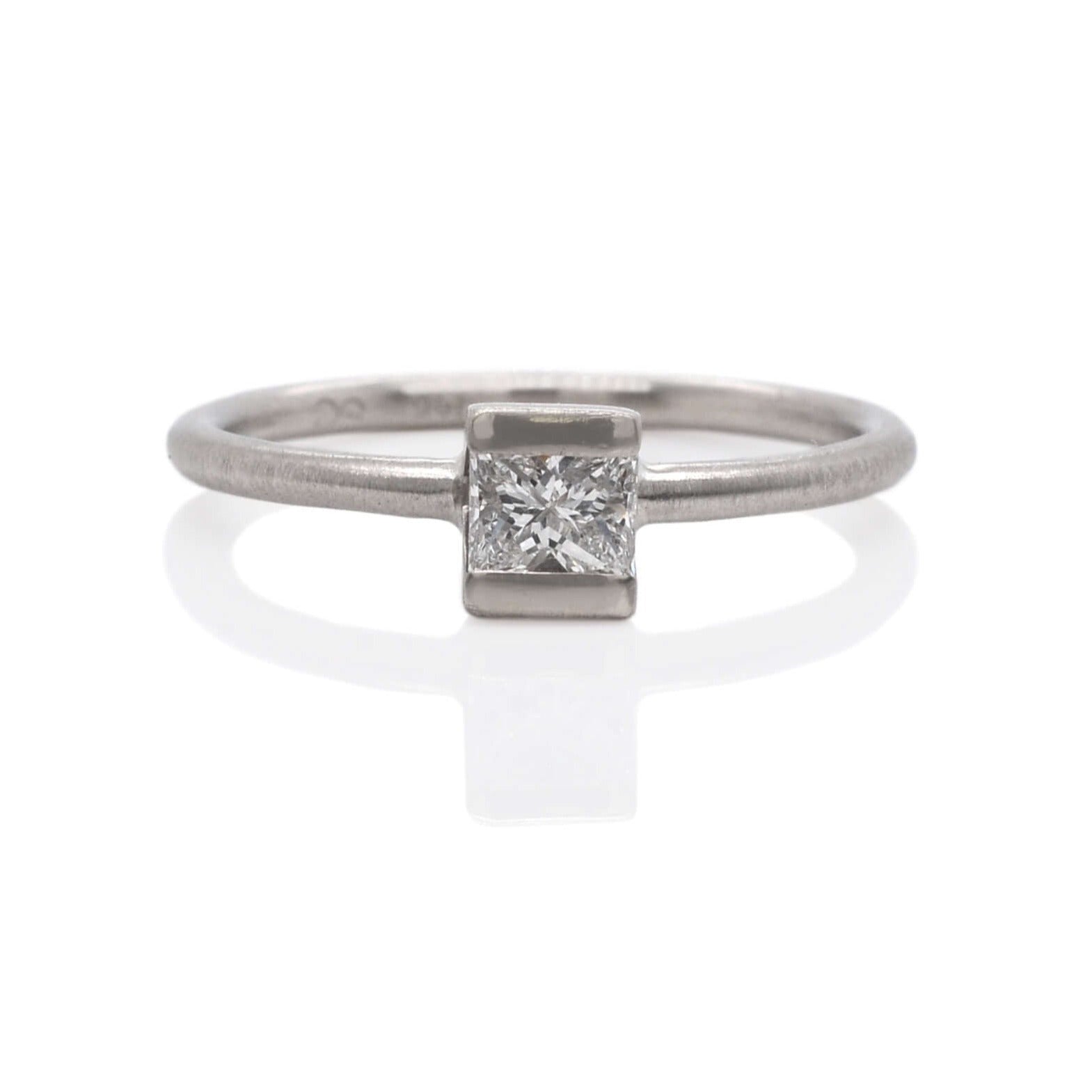 Princess cut diamond engagement ring in white gold. Handmade by EC Design Jewelry in Minneapolis, MN using recycled metal and conflict-free stone.