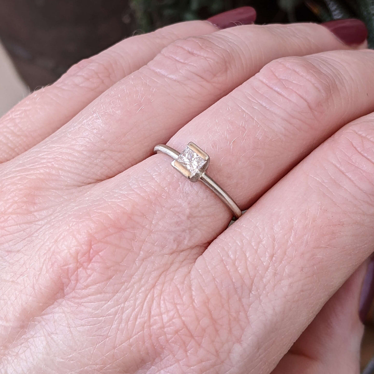 White princess cut diamond solitaire in white gold. Handmade by EC Design Jewelry in Minneapolis, MN.