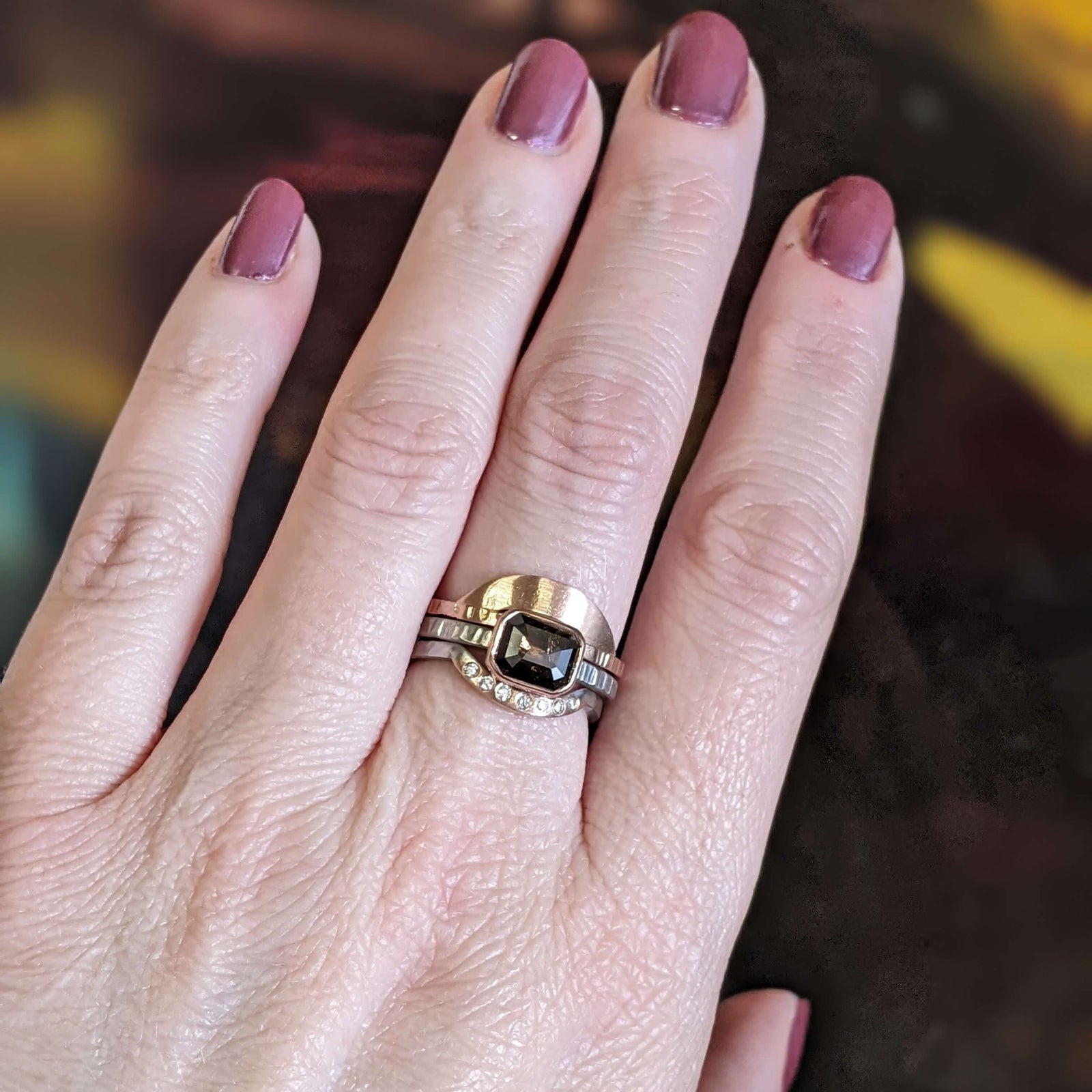 Textured 14k red gold arch band handmade with recycled metal. EC Design Jewelry in Minneapolis, MN.