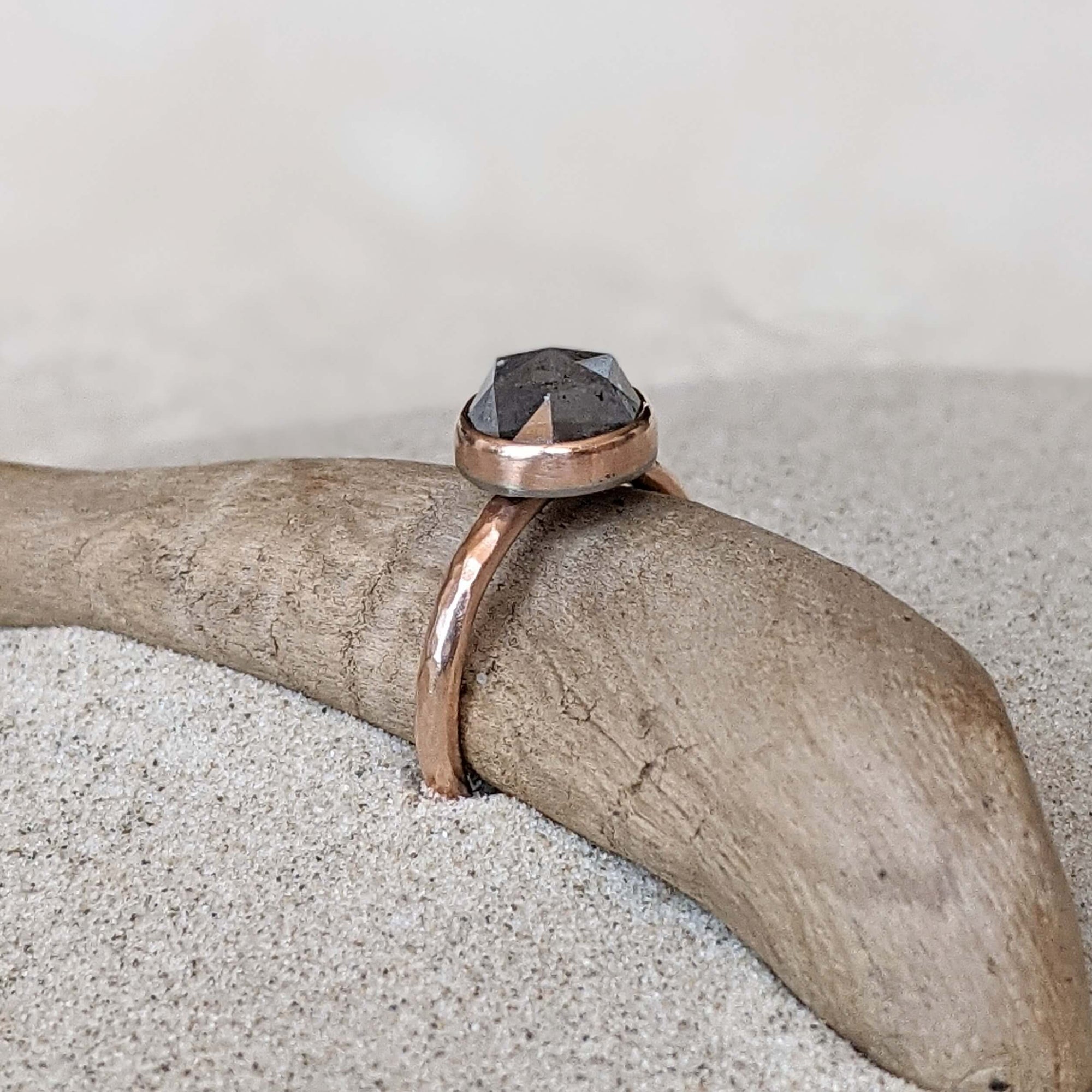 Gray diamond engagement ring set in red gold. Handmade with recycled metal and conflict-free stone. Ethically crafted by EC Design Jewelry in Minneapolis, MN.