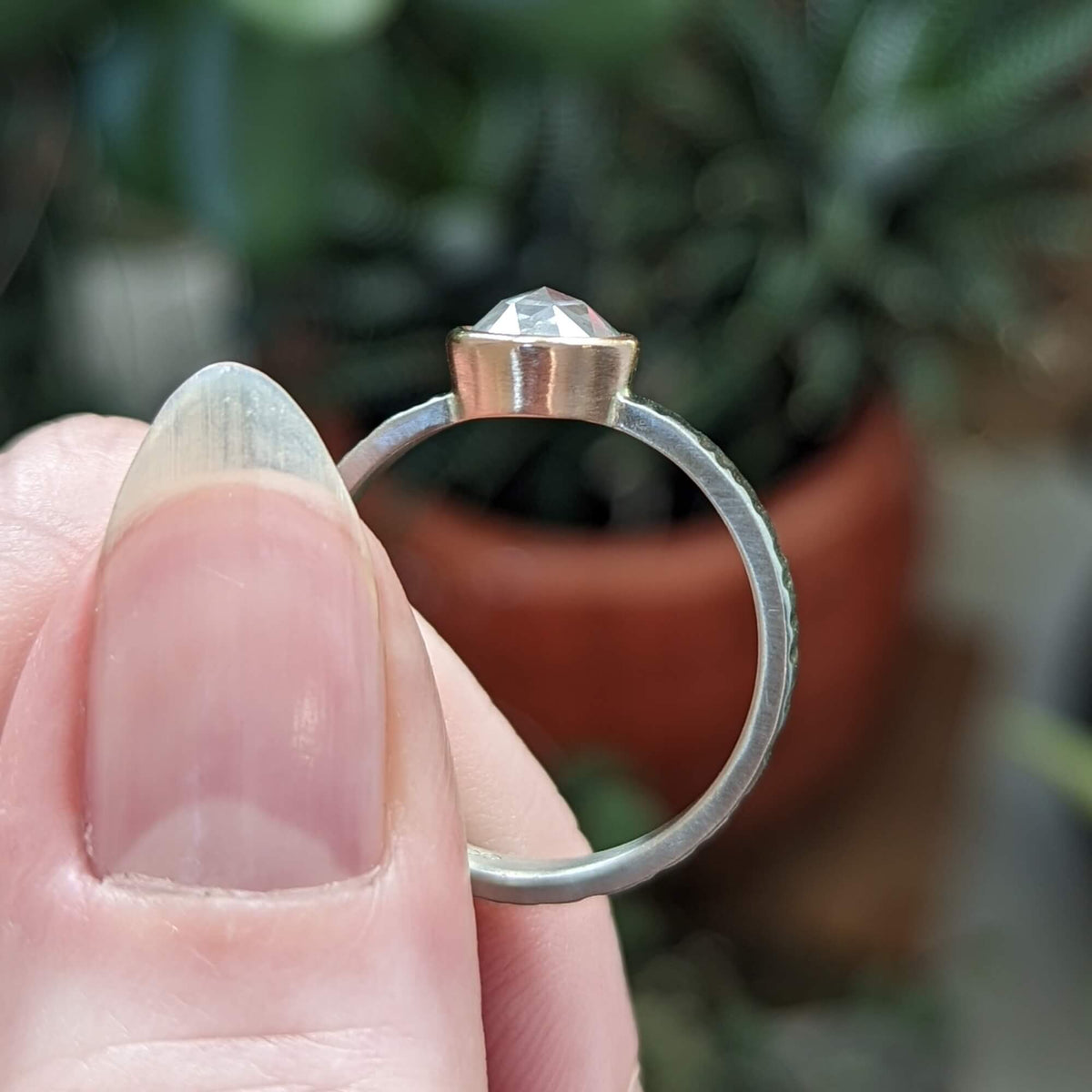 Profile photo of white rose cut diamond ring in palladium and rose gold.