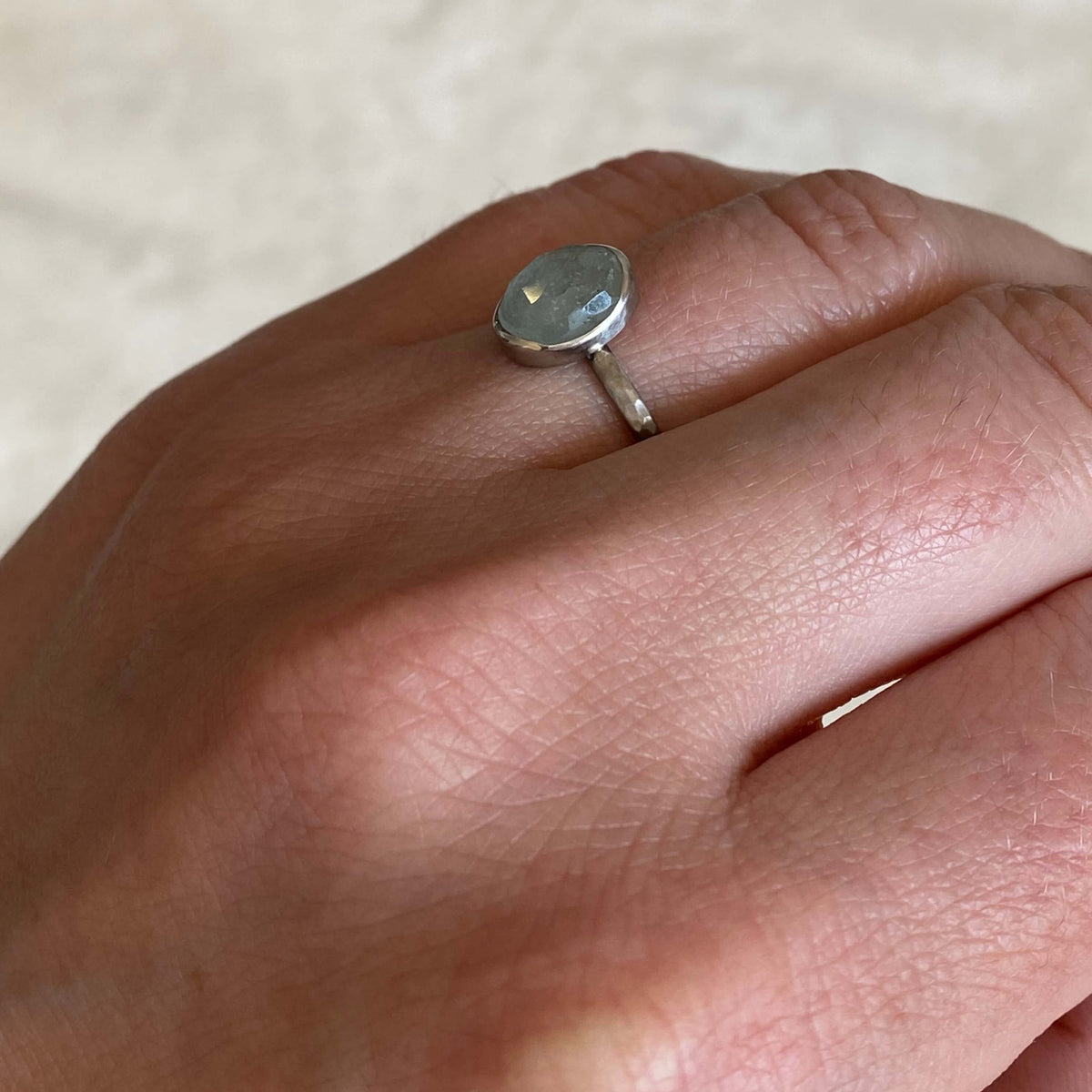 Rose cut sapphire bezel set in palladium. Ethically crafted by EC Design in Minneapolis, MN using recycled metal and conflict-free stone.