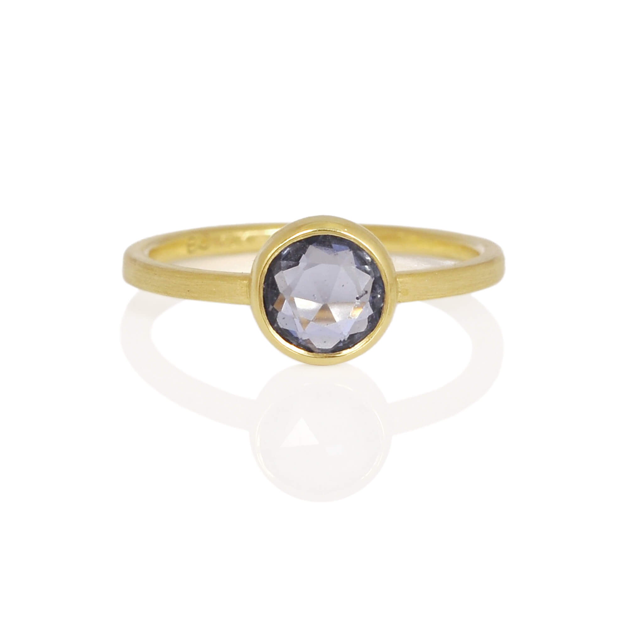 Ceylon blue rose cut sapphire ring in yellow gold. The stone has an open back bezel and a split shank for optimal shine. Handmade by EC Design Jewelry in Minneapolis, MN.