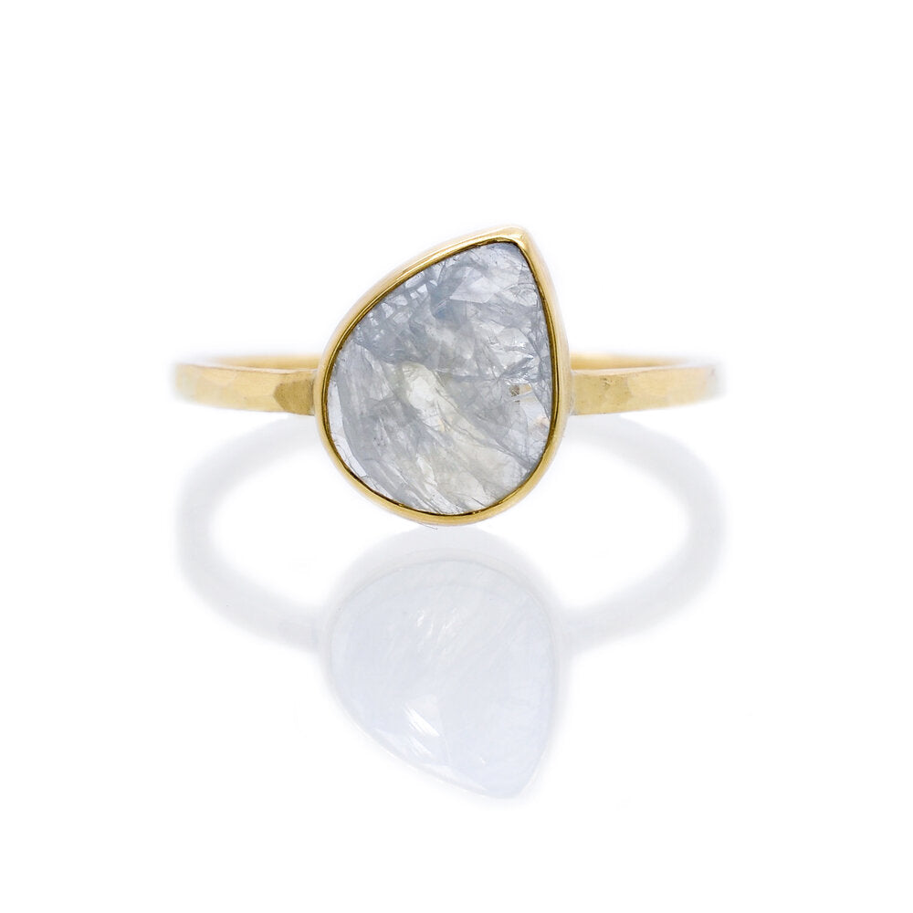 Ice blue rose cut sapphire in yellow gold. A great option for an alternative engagement ring. Handmade by EC Design Jewelry in Minneapolis, MN using recycled metal and conflict-free stone.