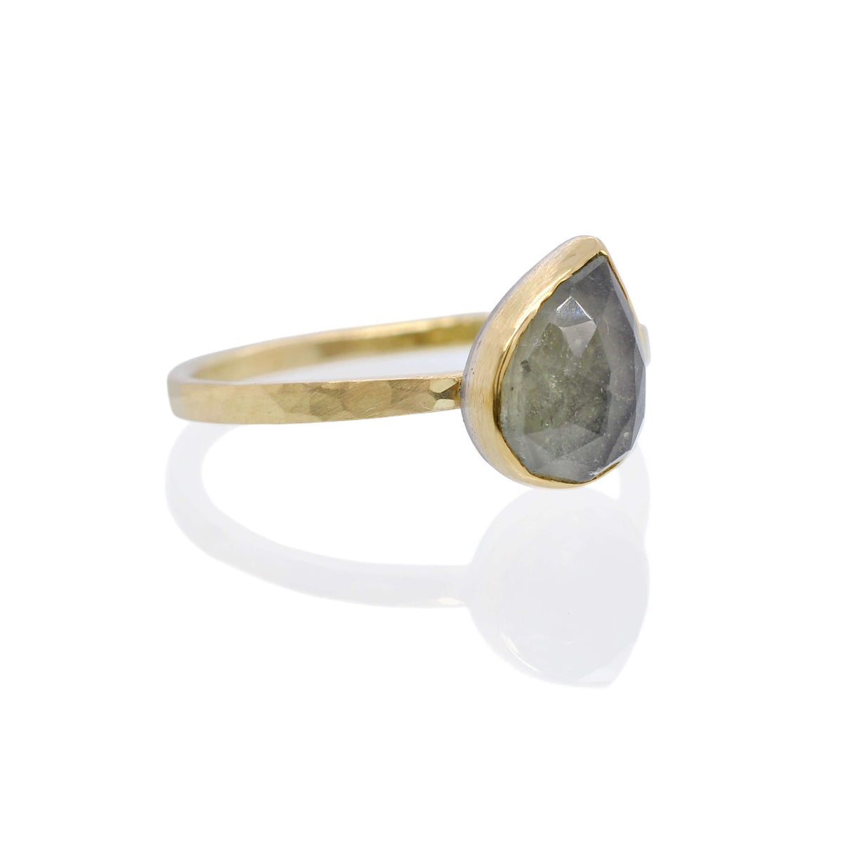 Alternative sapphire engagement ring. The rose cut stone is set in yellow gold on a hammered band of yellow gold. Made with recycled metal and conflict-free stone. Designed and created by EC Design Jewelry in Minneapolis, MN.