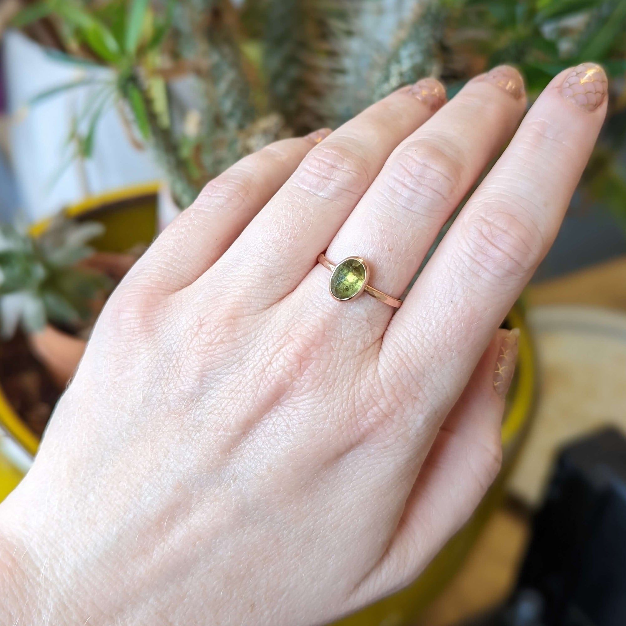 Green rose cut sapphire set in recycled rose gold.