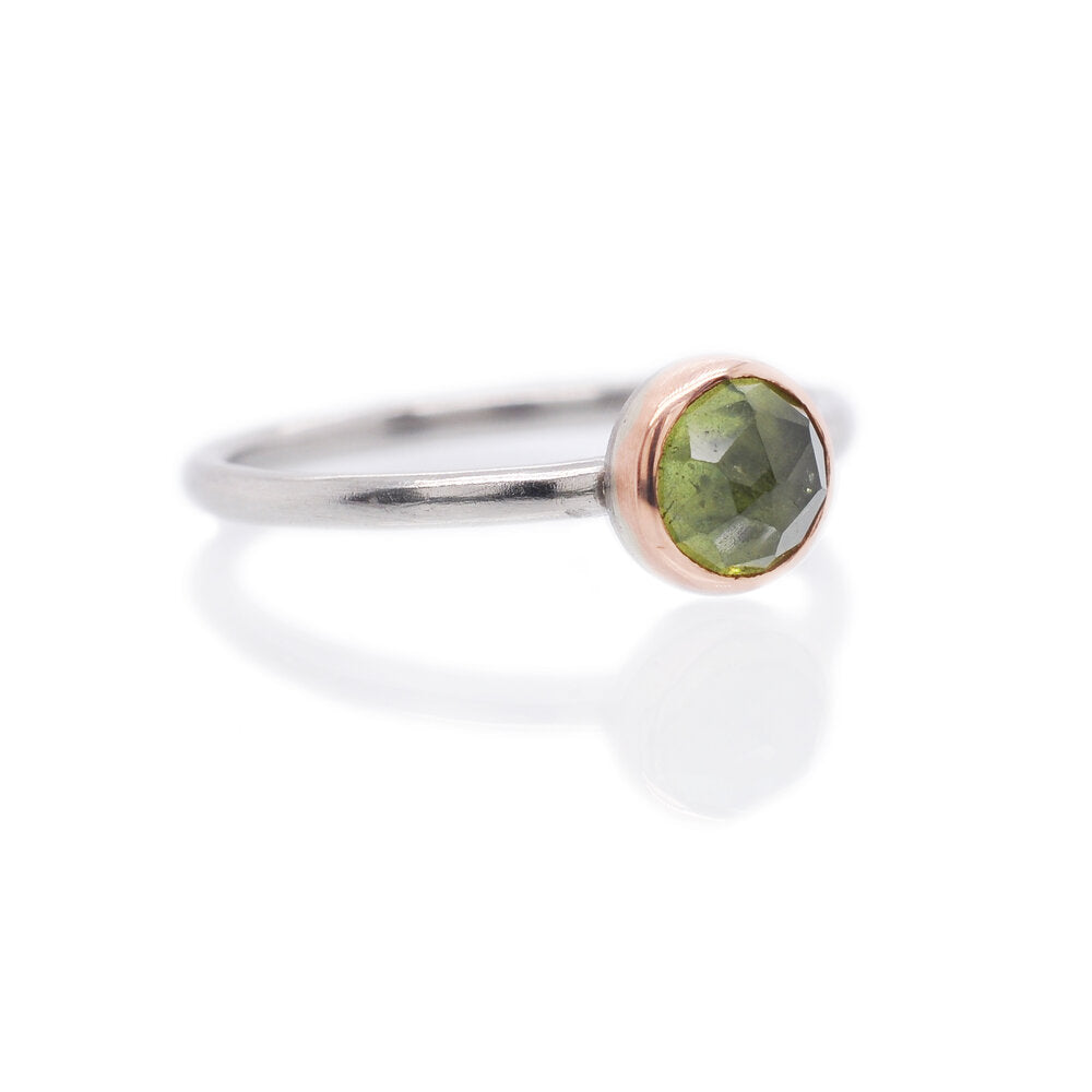 Green rose cut sapphire in red gold on a palladium band. Handmade by EC Design Jewelry in Minneapolis, MN using recycled metal and conflict-free stone.