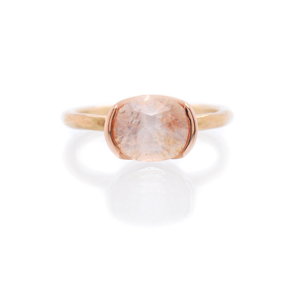 Peach sapphire engagement ring. Handmade by EC Design Jewelry using recycled metal and conflict-free stone.