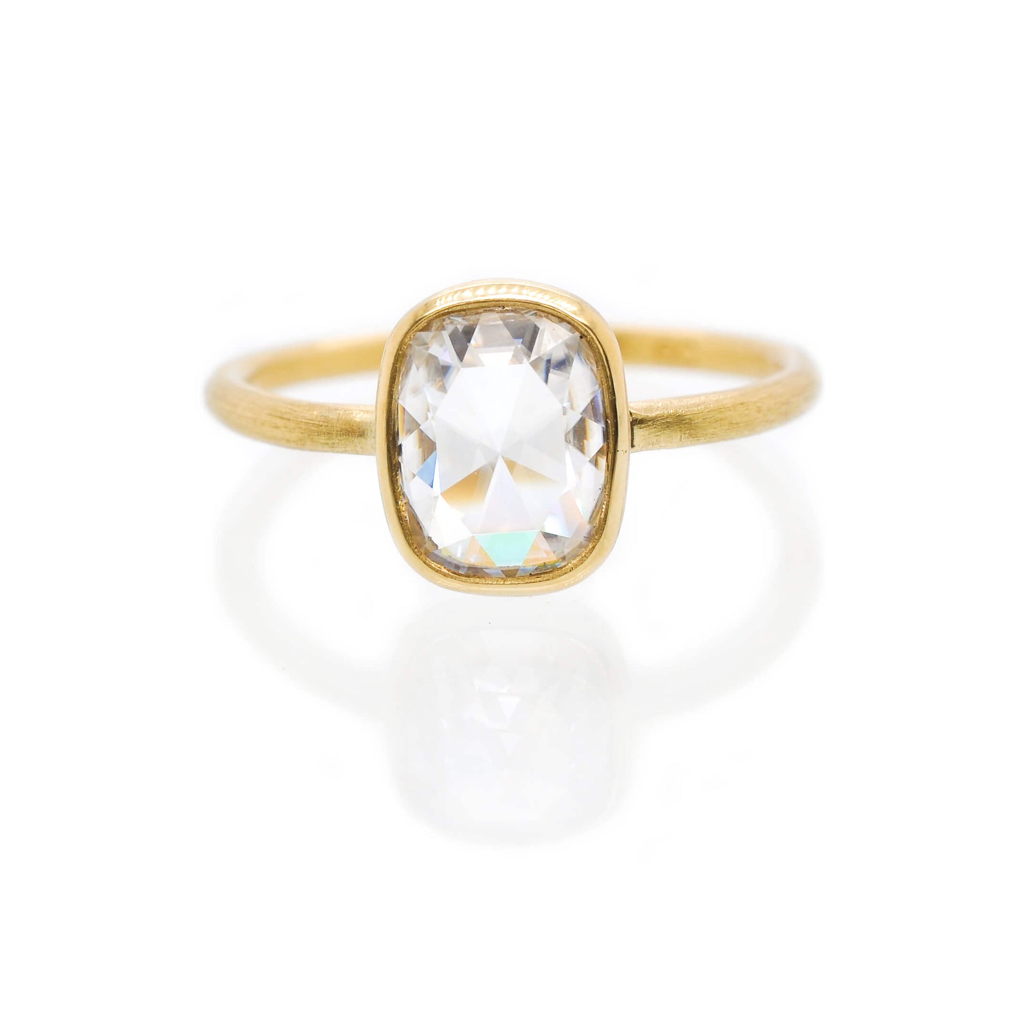 Cushion cut Moissanite ring in 18k yellow gold. Handmade by EC Design Jewelry in Minneapolis, MN.