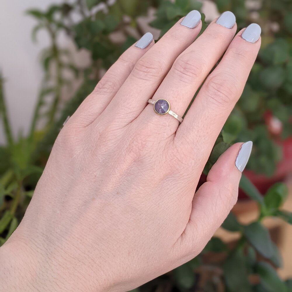 Lavender sapphire engagement ring with yellow gold bezel on a silver band. Handmade by EC Design Jewelry in Minneapolis, MN using recycled metal and conflict-free stone.