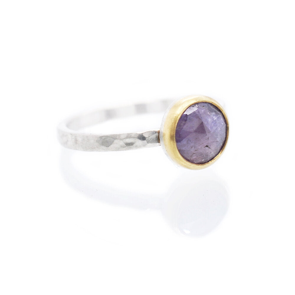 Lavender sapphire engagement ring with yellow gold bezel on a silver band. Handmade by EC Design Jewelry in Minneapolis, MN using recycled metal and conflict-free stone.