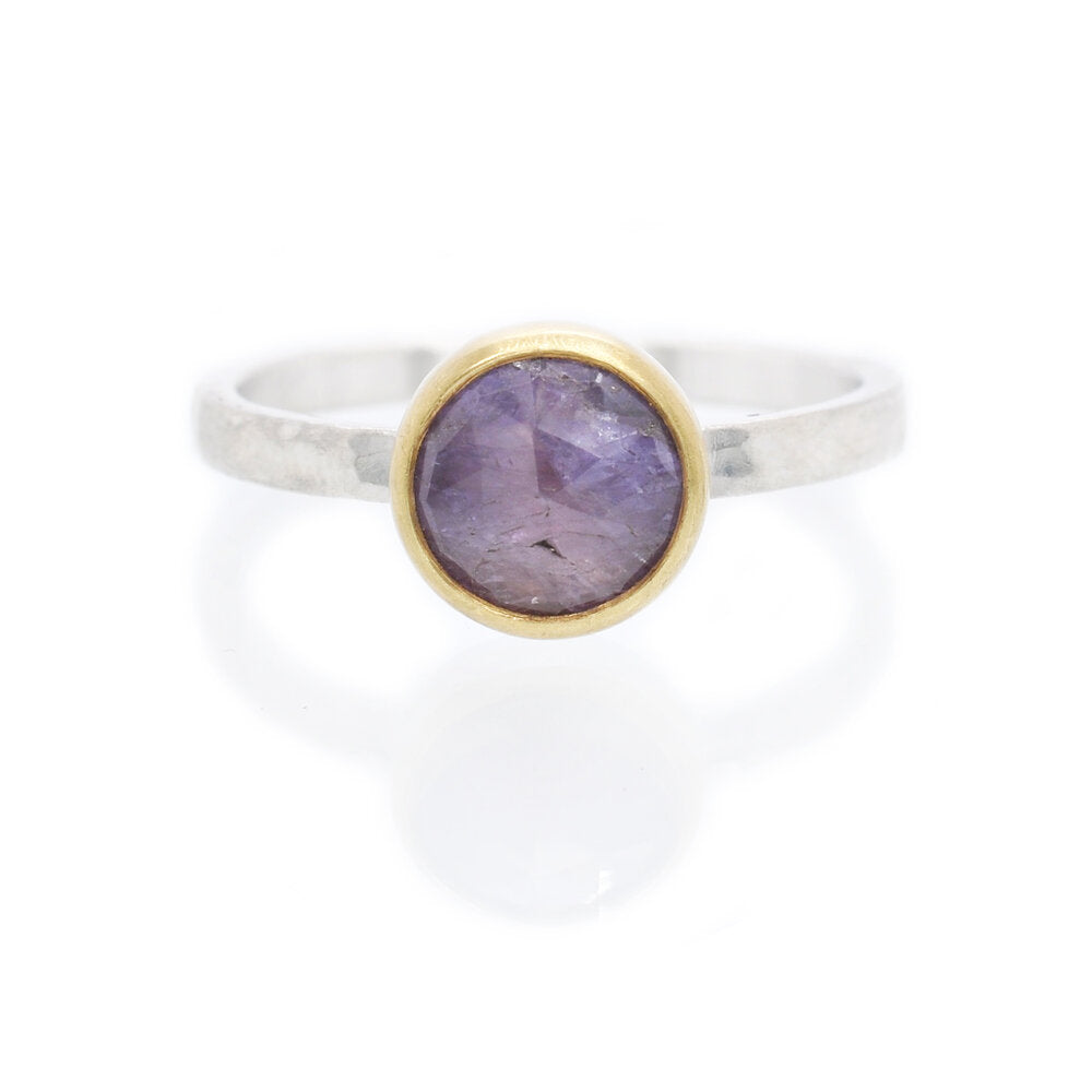 Lavender sapphire engagement ring with yellow gold bezel on a silver band. Handmade by EC Design Jewelry in Minneapolis, MN using recycled metal and conflict-free stone.