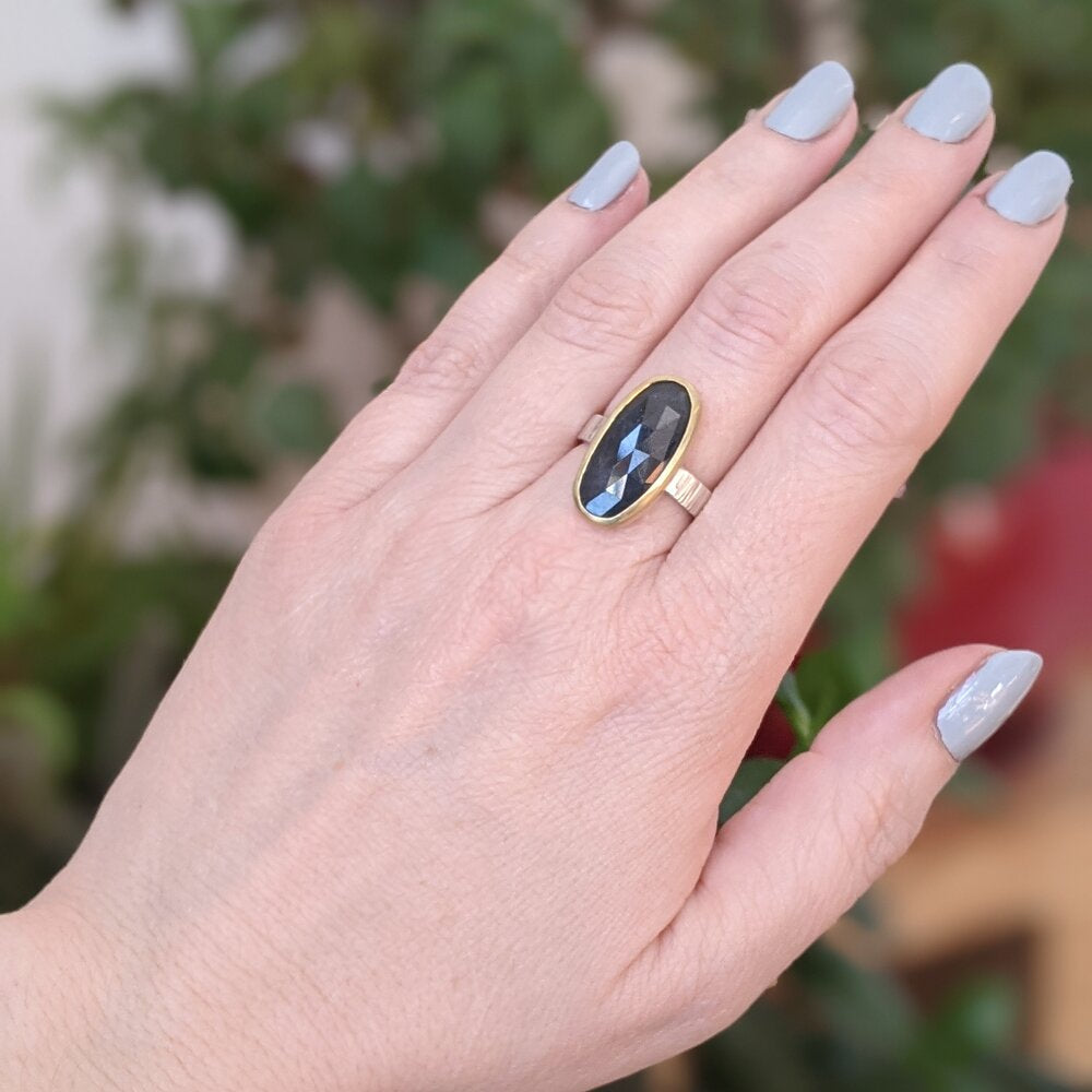 Teal green sapphire cocktail ring in yellow gold with sterling silver band. Handmade by EC Design in Minneapolis, MN using recycled metal and conflict-free stone.