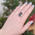 Teal green sapphire cocktail ring in yellow gold with sterling silver band. Handmade by EC Design in Minneapolis, MN using recycled metal and conflict-free stone.