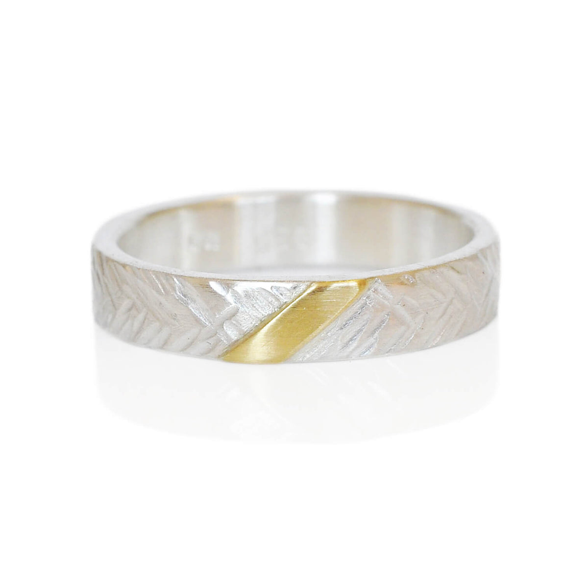 Hammered sterling silver yellow gold wedding band. Handmade with recycled metal.
