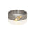 Hammered palladium wedding band with flush-set diamond in yellow gold. Handmade by EC Design Jewelry in Minneapolis, MN using recycled metal and conflict-free stone.