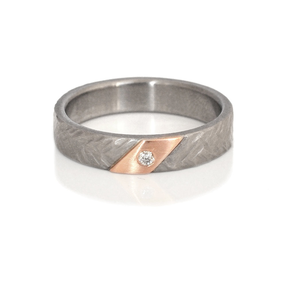 Hammered palladium and red gold wedding band with diamond accent. Handmade by EC Design Jewelry in Minneapolis, MN using recycled metal and conflict-free stone.