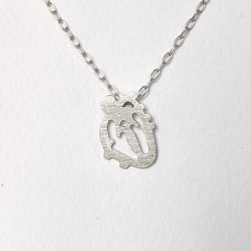 Sterling silver anatomical heart pendant from EC Design Jewelry in Minneapolis, MN. Handmade with recycled metal.