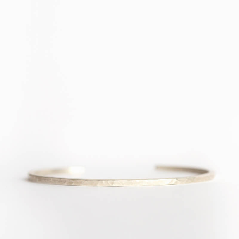 Round hammered sterling silver cuff. Handmade by EC Design Jewelry in Minneapolis, MN.