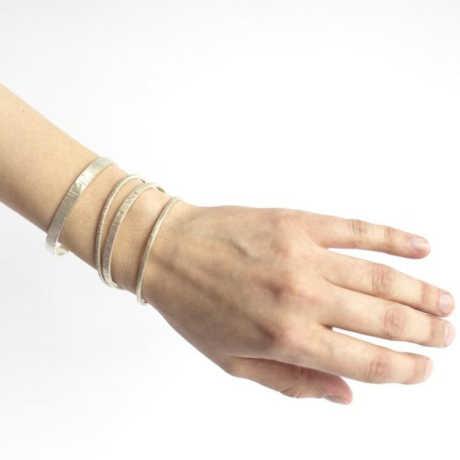 Random hammered sterling silver cuff. Handmade by EC Design Jewelry in Minneapolis, MN using recycled metal.