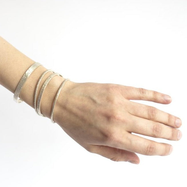 Silk hammered sterling silver bracelets from EC Design Jewelry in Minneapolis, MN.