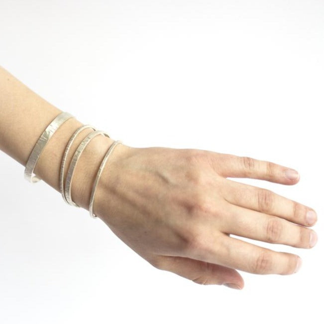 Sterling silver cuffs from EC Design.