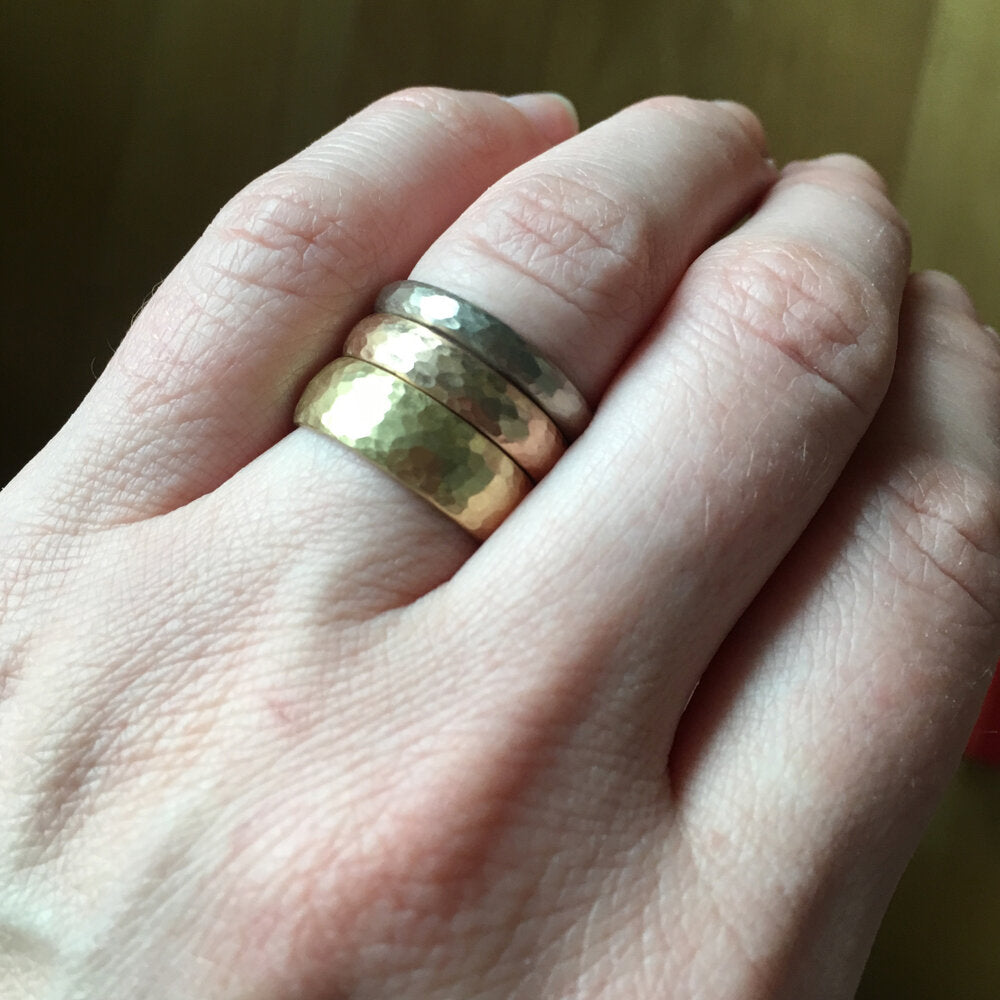 Handmade 14k yellow gold hammered band. Made by EC Design Studio in Minneapolis, MN using recycled metal.