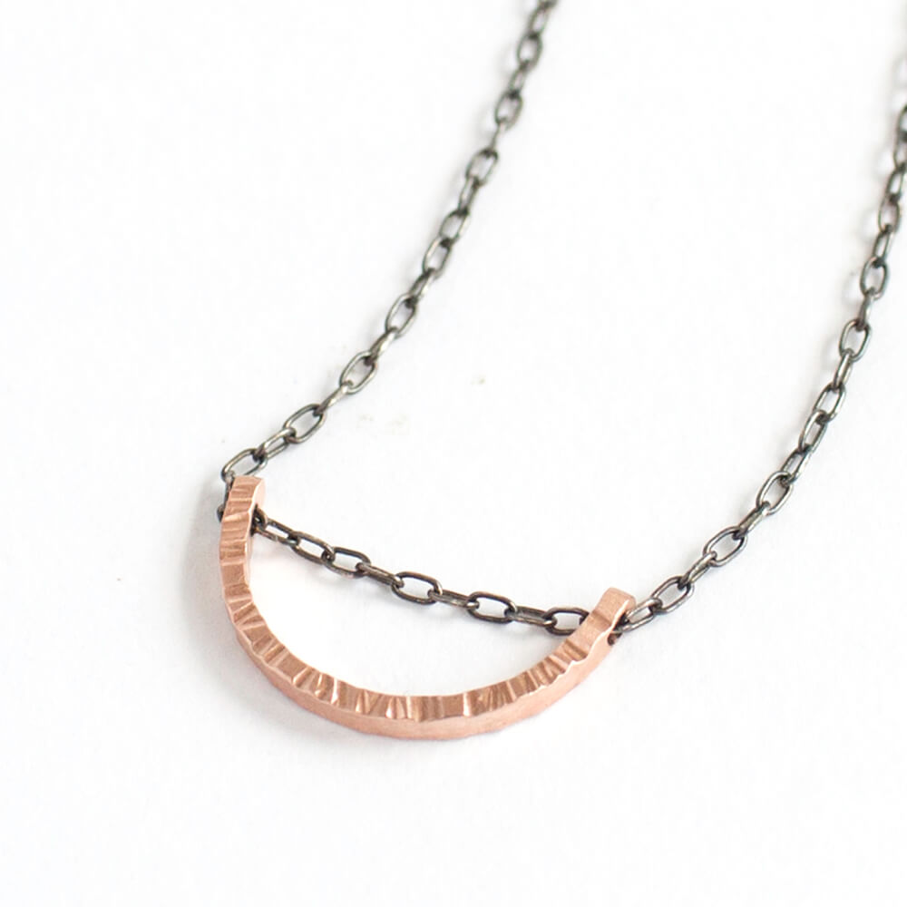 Linear hammered red gold half moon necklace. Handmade by EC Design using recycled metal.