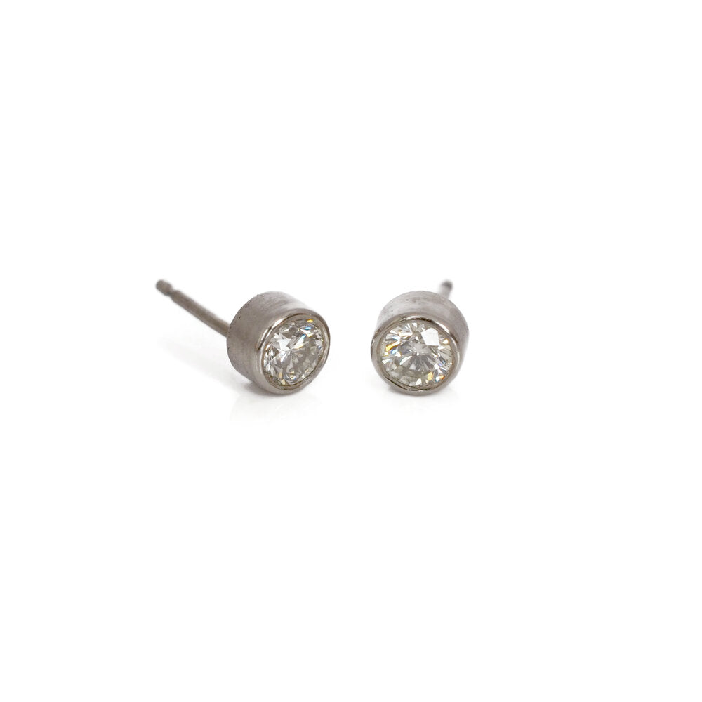 White diamond and palladium stud earrings. Handmade in Minneapolis, MN by EC Design Studio using recycled metal and conflict-free stones.