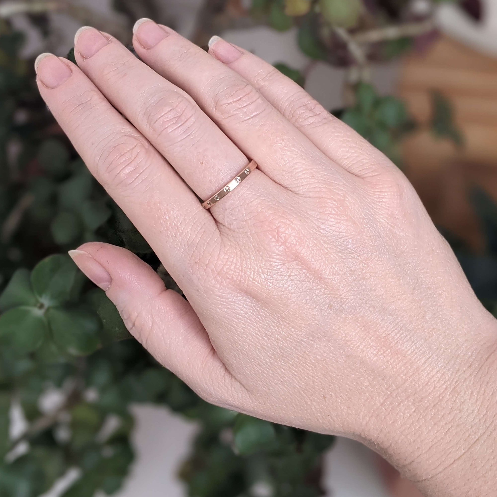 Rose gold and champagne diamond eternity band. Handmade by EC Design Jewelry in Minneapolis, MN using recycled metal and conflict-free stones.