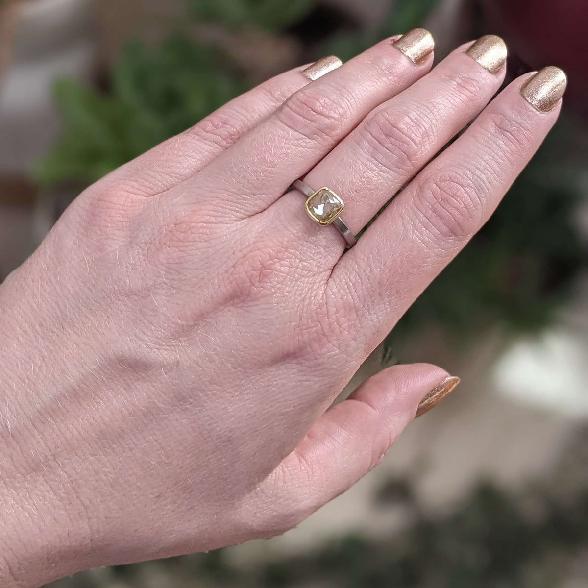 Yellow diamond engagement ring in palladium and yellow gold.