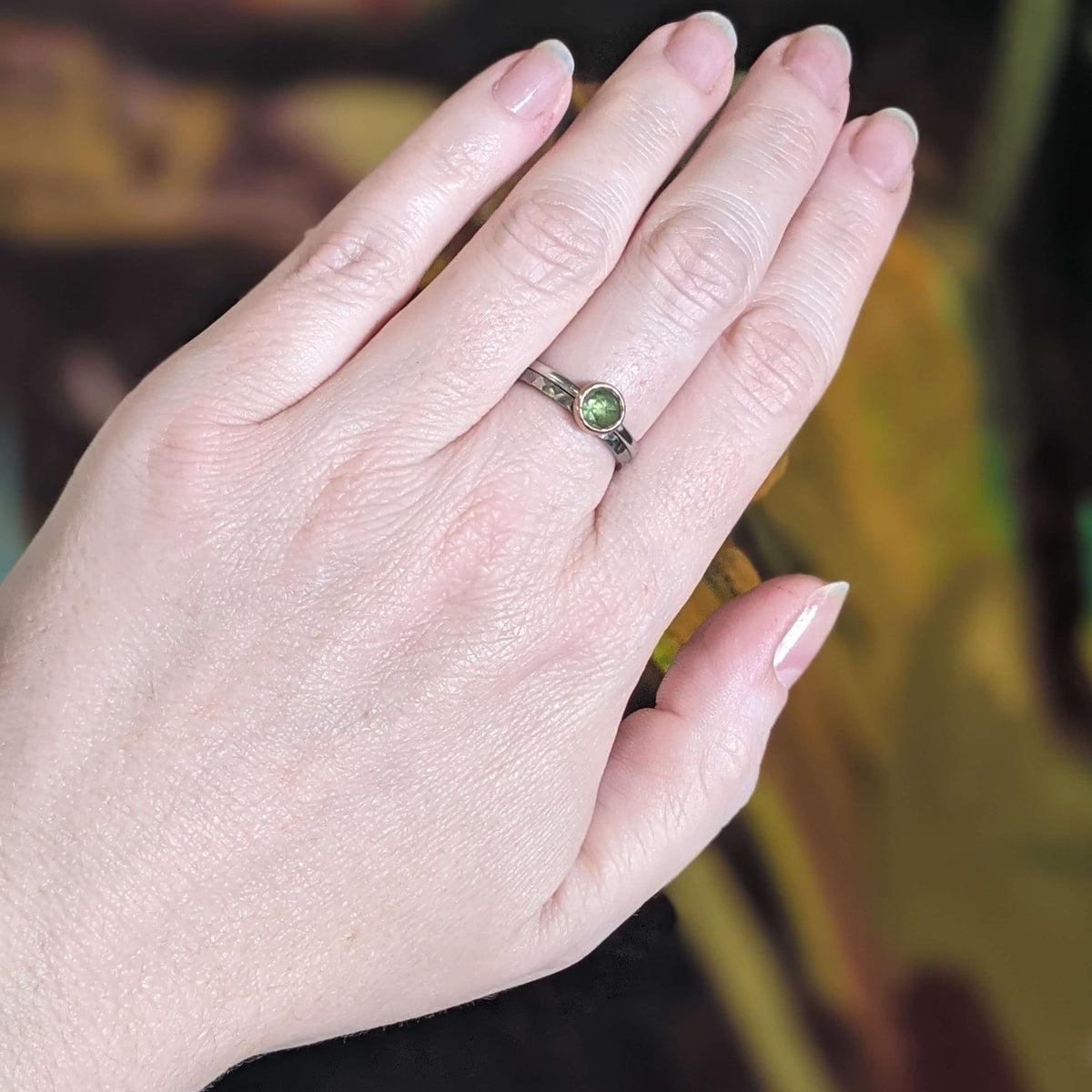 Hammered palladium band and rose cut green sapphire solitaire pair. Handmade by EC Design Jewelry in Minneapolis, MN.