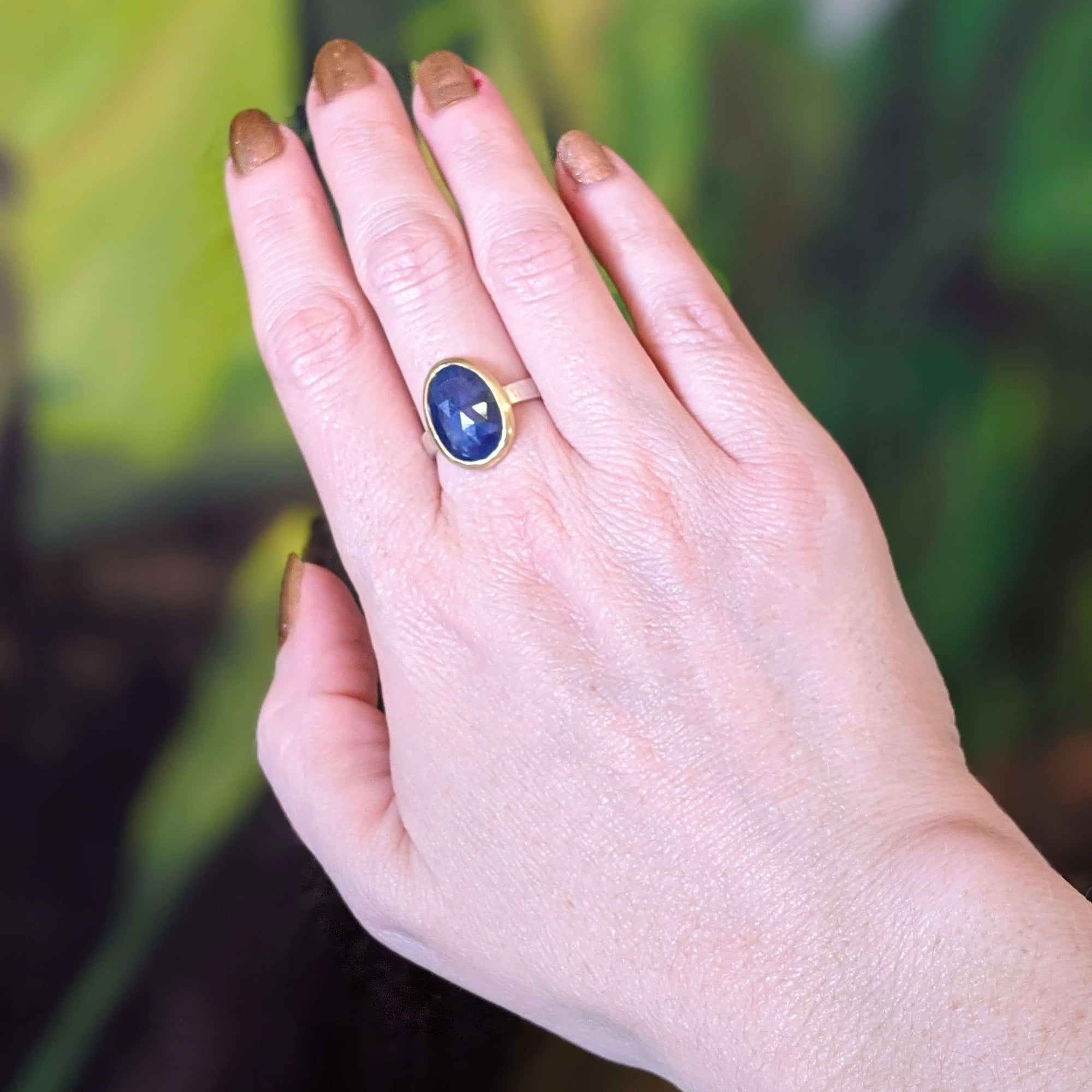 Blue rose cut sapphire ring in yellow gold and hammered sterling silver. Handmade with recycled metal and conflict-free stone. Design and created at EC Design Studio in Minneapolis, MN.