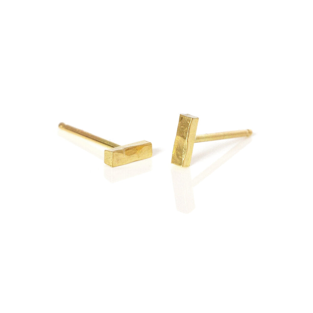 Solid 18k yellow gold round hammered bar studs. Handmade in Minneapolis, MN by EC Design Jewelry using recycled metal.