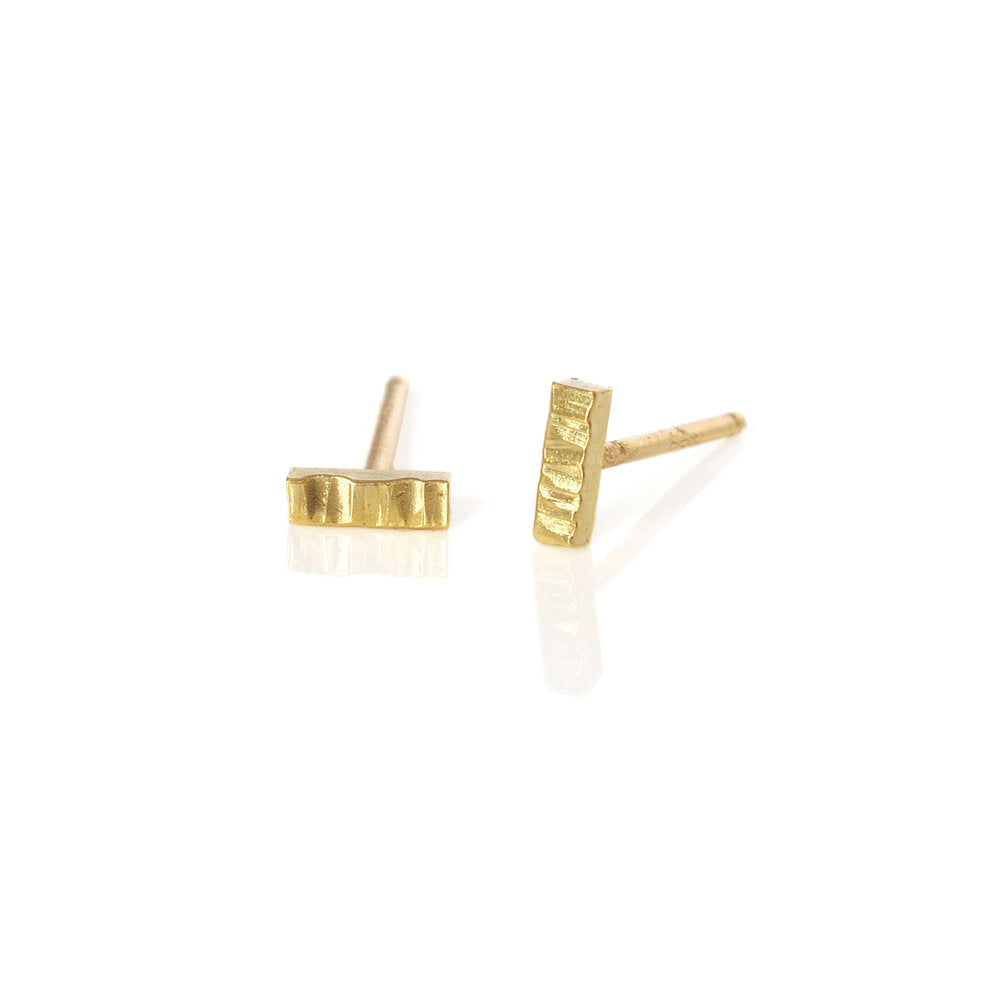 Linear and round hammered solid gold bar studs.